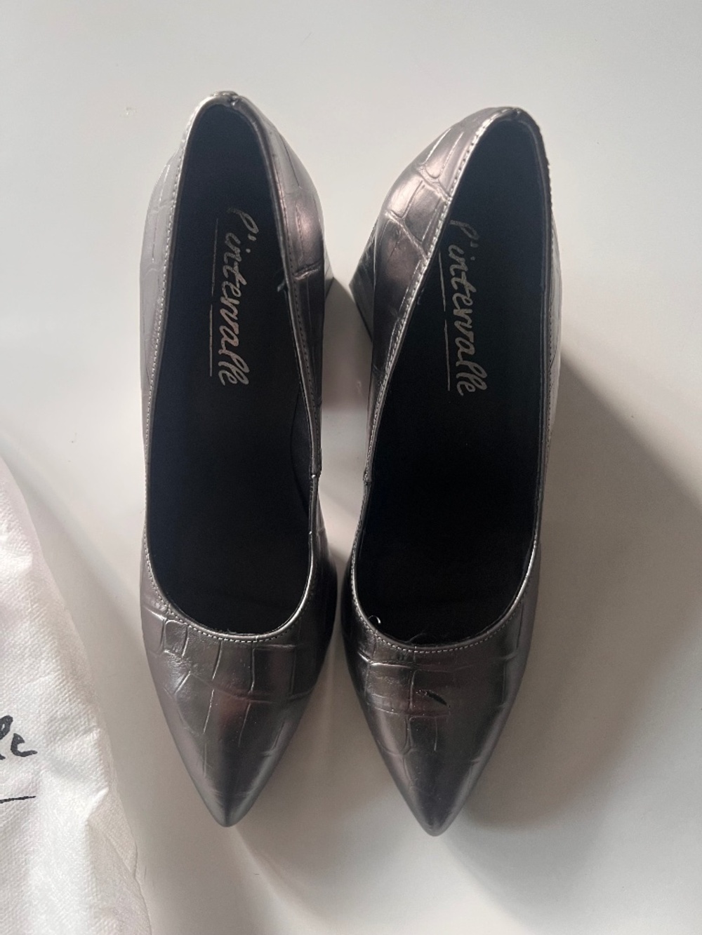 L'Intervalle 3.5" silver heels in a "snakeskin" print.